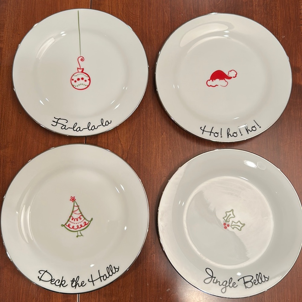 Set of 4 St. Nicholas Square Holiday Porcelain Plates with Silver Trim.
